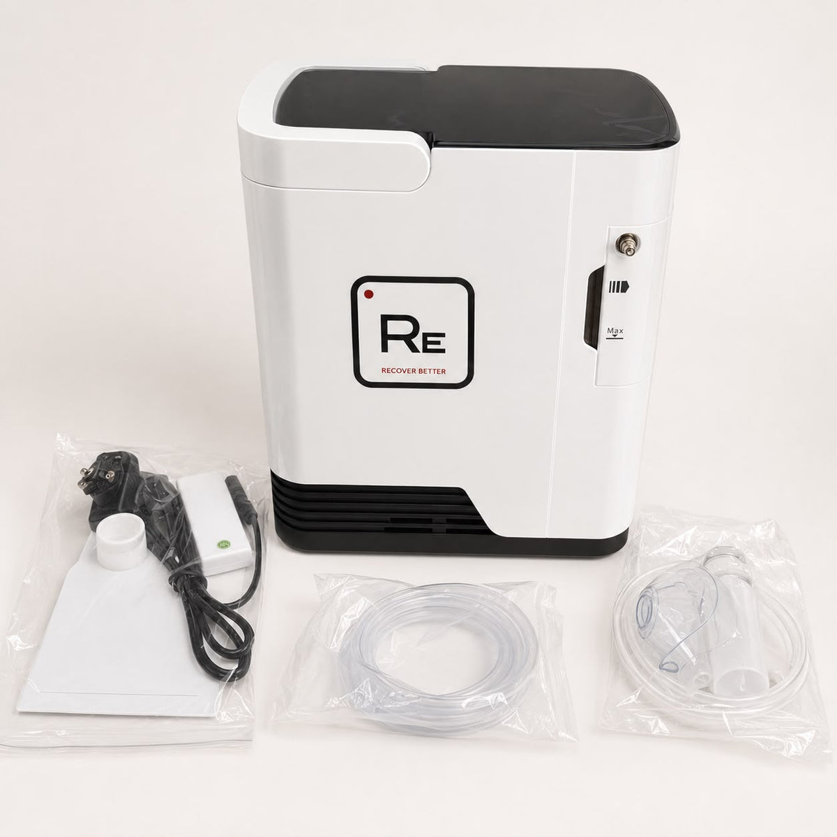 Restore Compact Oxygen Concentrator with supplied accessories on a white background