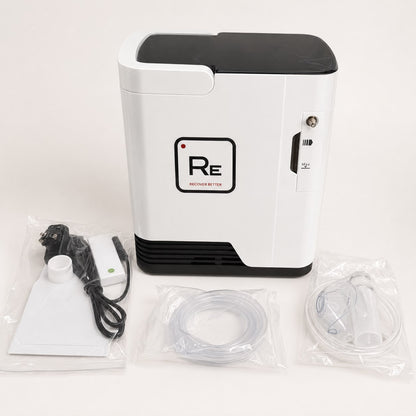 Restore Compact Oxygen Concentrator with supplied accessories on a white background