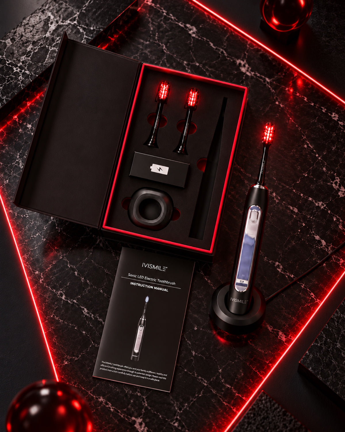 LED Electric Toothbrush on its charging base beside the open gift box, spare heads and manual