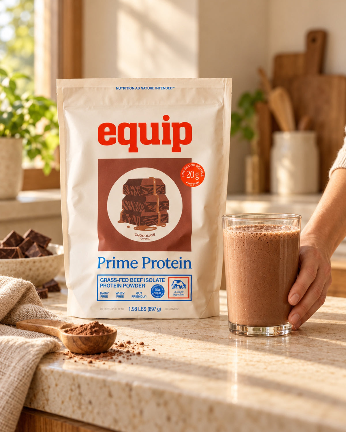 Equip Prime Protein Chocolate pouch next to a chocolate protein shake