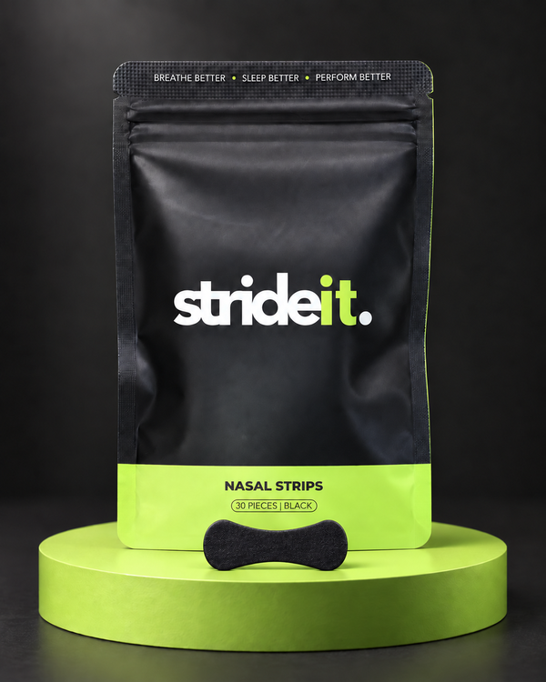 Stride Nasal Strips 30 pack in black on a lime green podium with a single strip in front